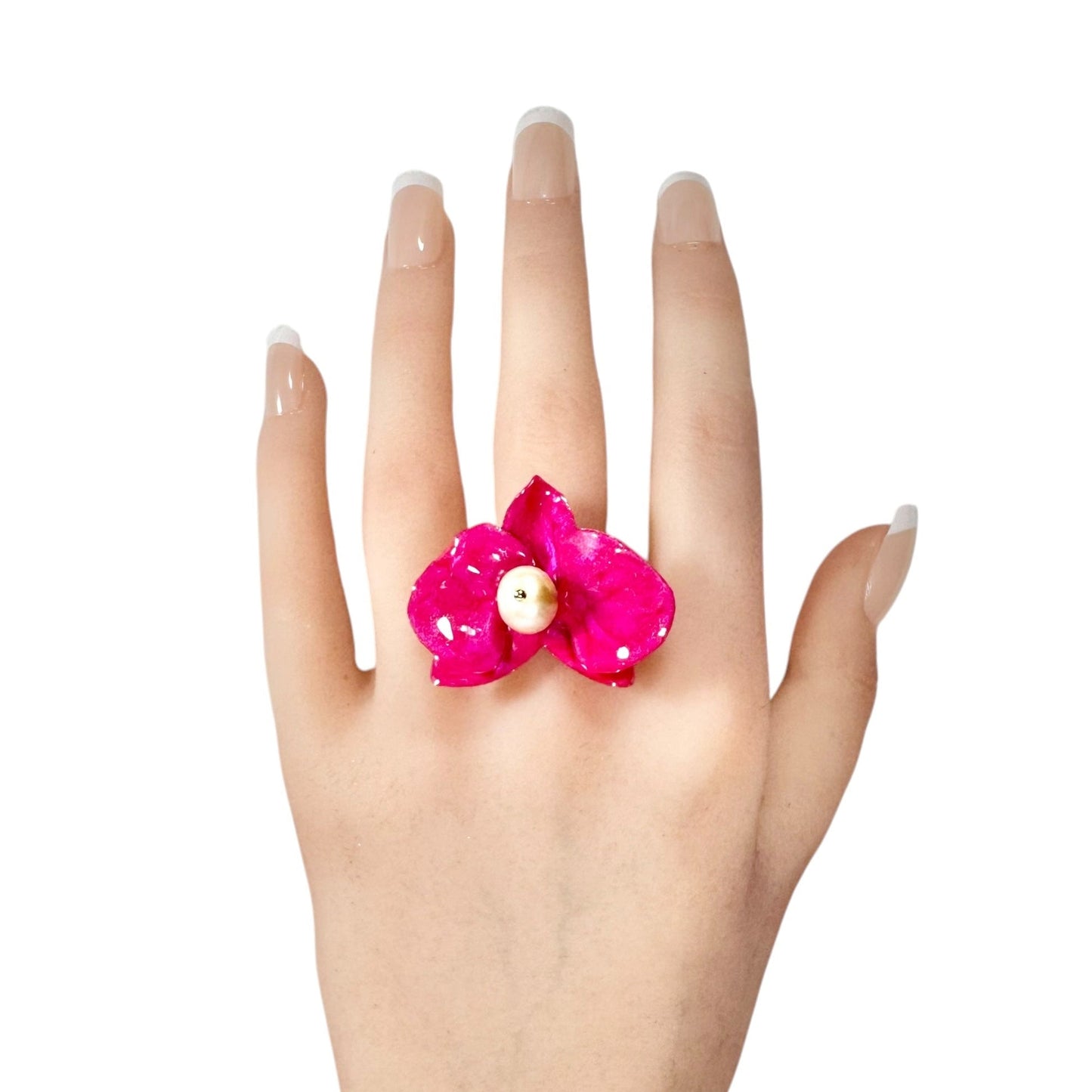 Statement flower ring inspired by orchid petals in rich red, sustainably handcrafted from upcycled materials.