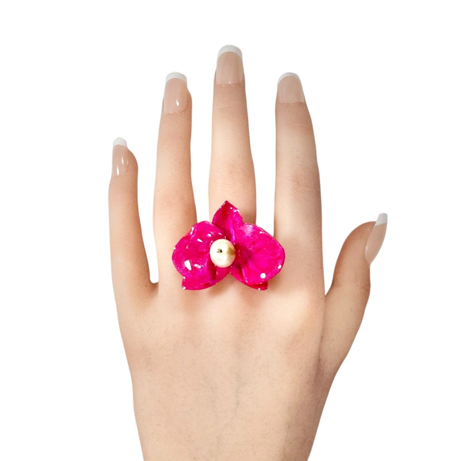 Statement flower ring inspired by orchid petals in rich red, sustainably handcrafted from upcycled materials.