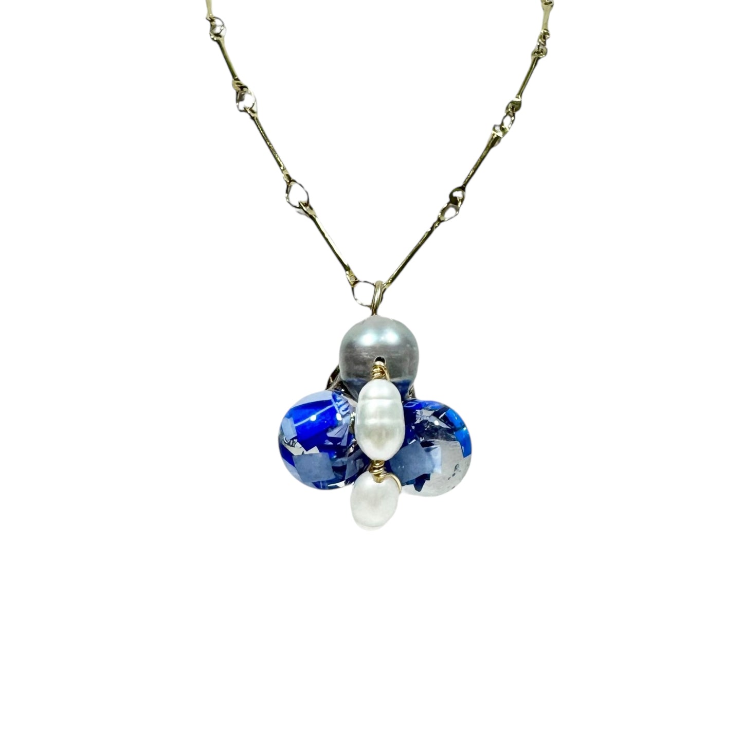 Bee Divine blue bee necklace with fresh water pearls handcrafted from upcycled plastic, featuring delicate bee-inspired designs with lightweight, eco-friendly materials. A sustainable statement piece for nature lovers.