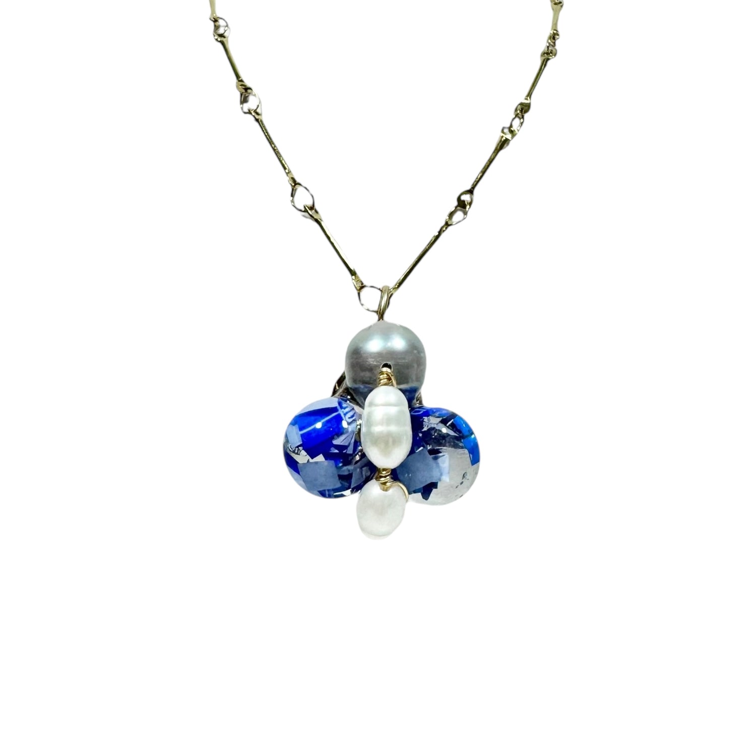 Bee Divine blue bee necklace with fresh water pearls handcrafted from upcycled plastic, featuring delicate bee-inspired designs with lightweight, eco-friendly materials. A sustainable statement piece for nature lovers.