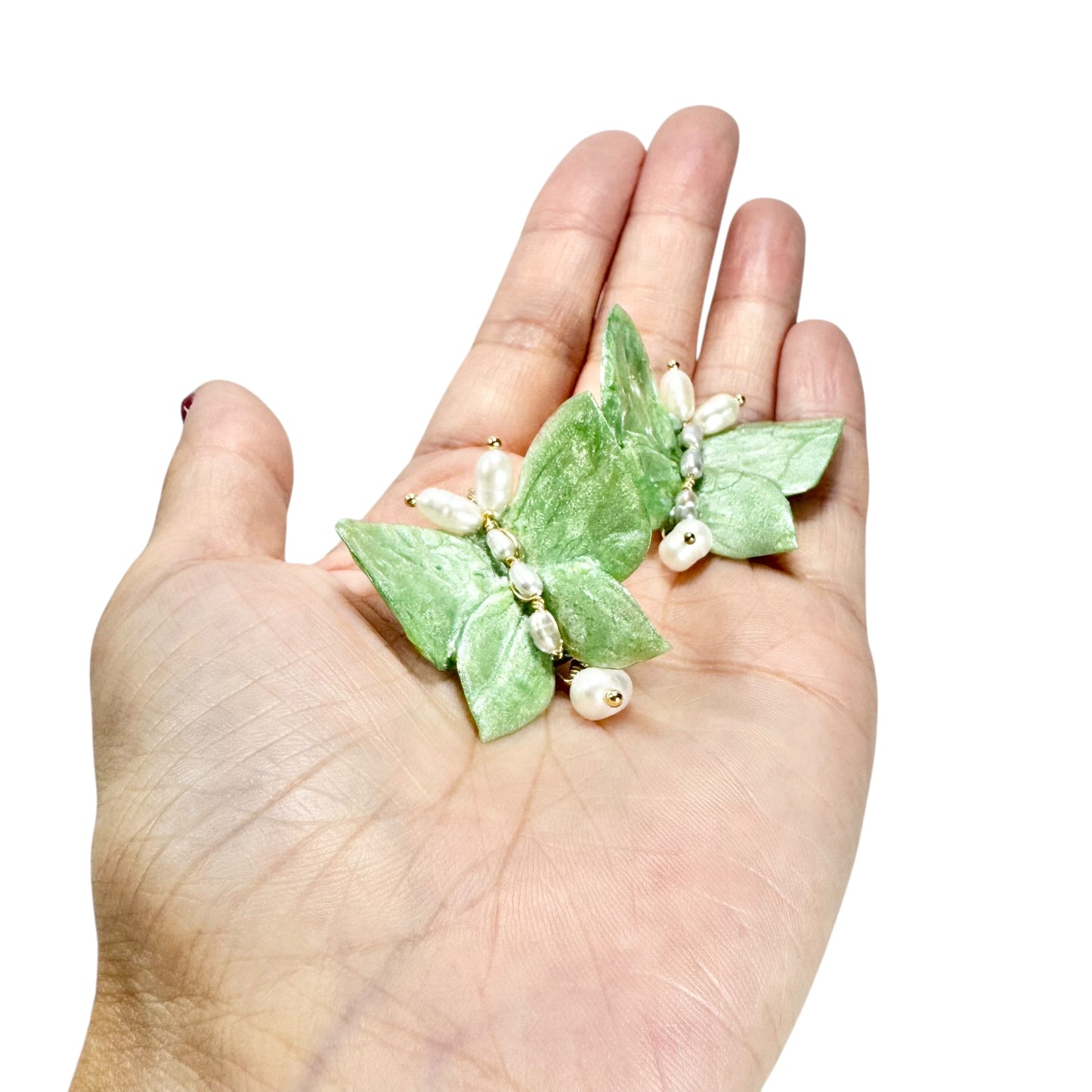 Upcycled butterfly earrings in soft mint green, handcrafted with a nature-inspired design and finished in a fresh Mint Breeze tone.