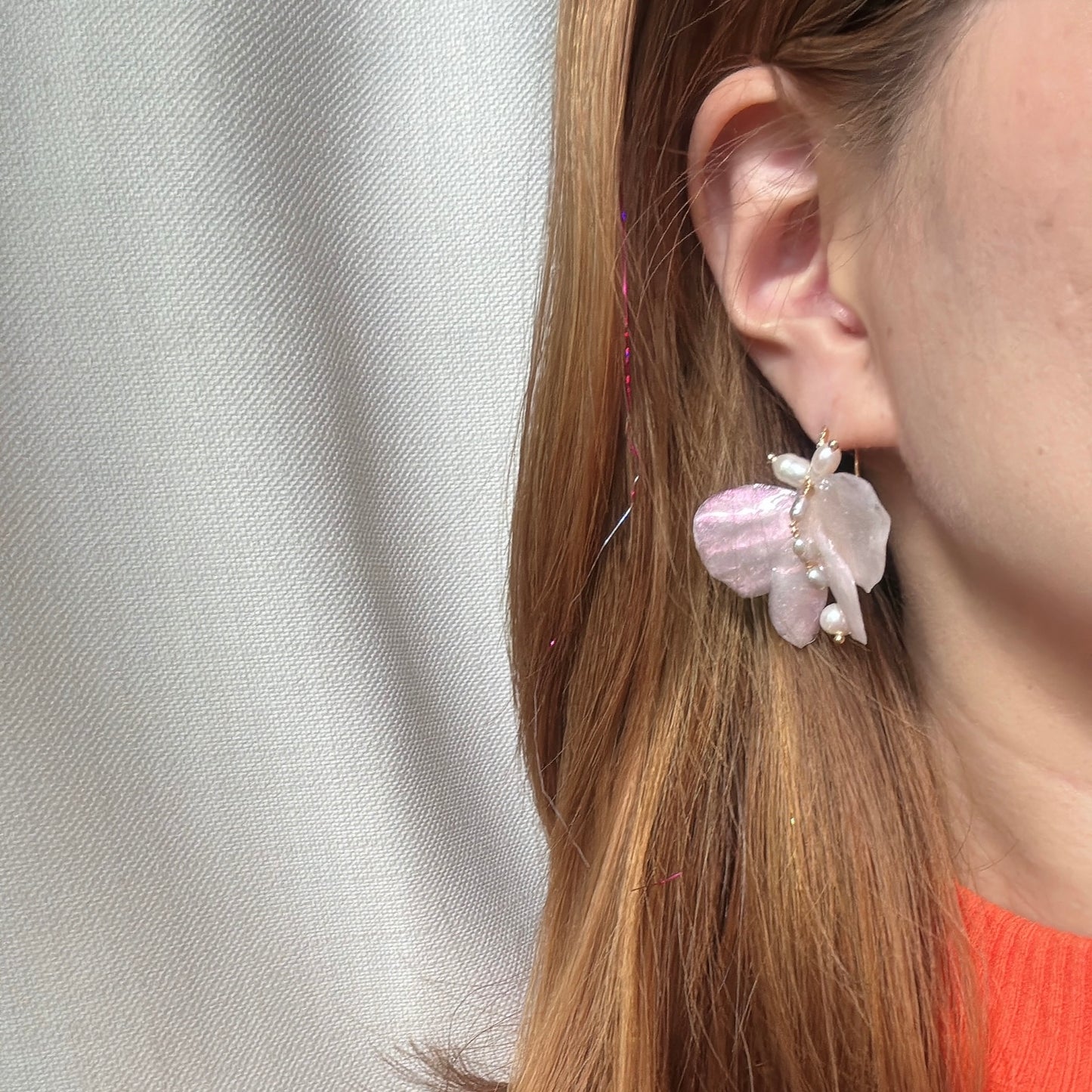 Handcrafted butterfly-shaped earrings in pearl white, made from upcycled materials and finished in a luminous White Silk tone.