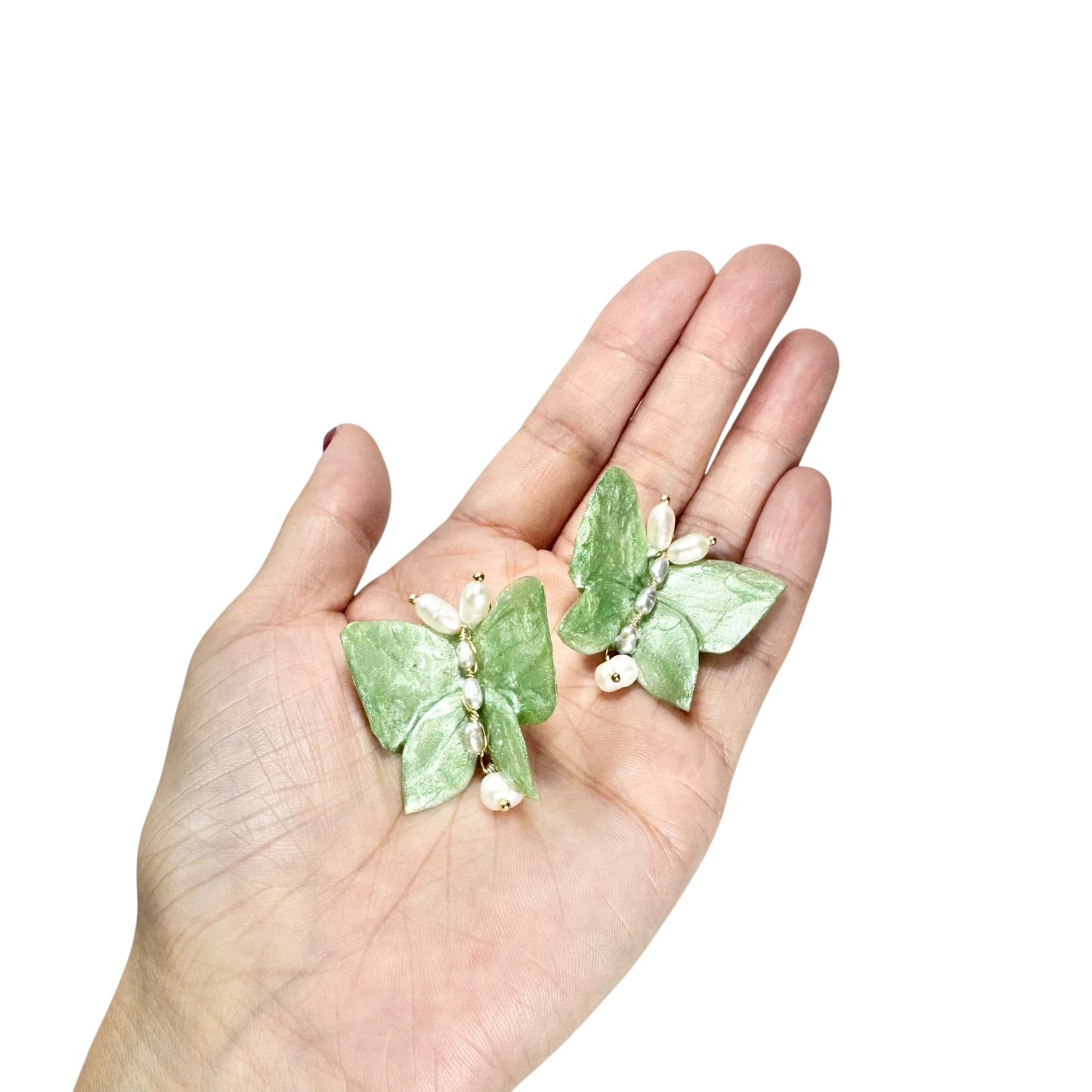 Upcycled butterfly earrings in soft mint green, handcrafted with a nature-inspired design and finished in a fresh Mint Breeze tone.