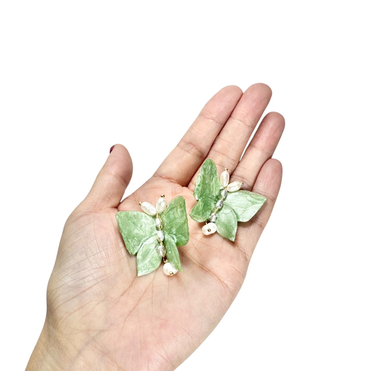 Upcycled butterfly earrings in soft mint green, handcrafted with a nature-inspired design and finished in a fresh Mint Breeze tone.