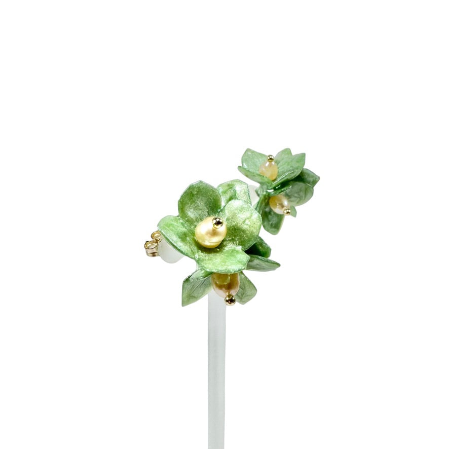 Lilac Fantasy earrings handcrafted from upcycled plastic, featuring pastel lilac, mint green, and black accents. Lightweight, eco-friendly statement jewelry for sustainable fashion lovers.