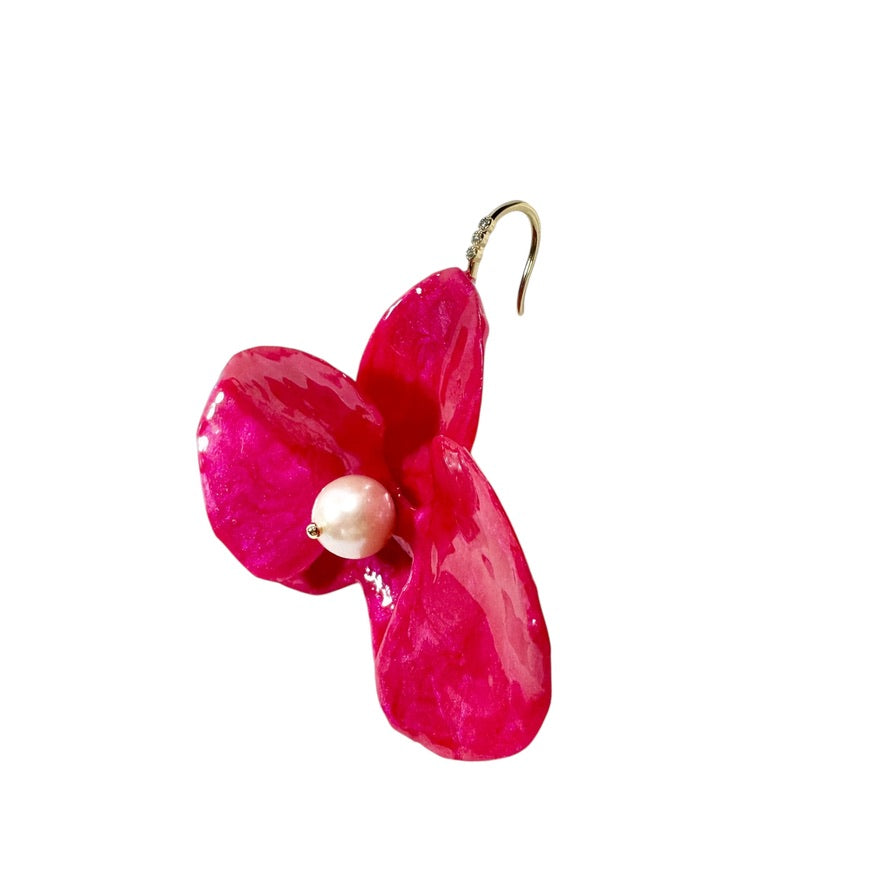 Handcrafted orchid-shaped earrings made from upcycled materials in rich red tones, symbolizing passion and elegance.