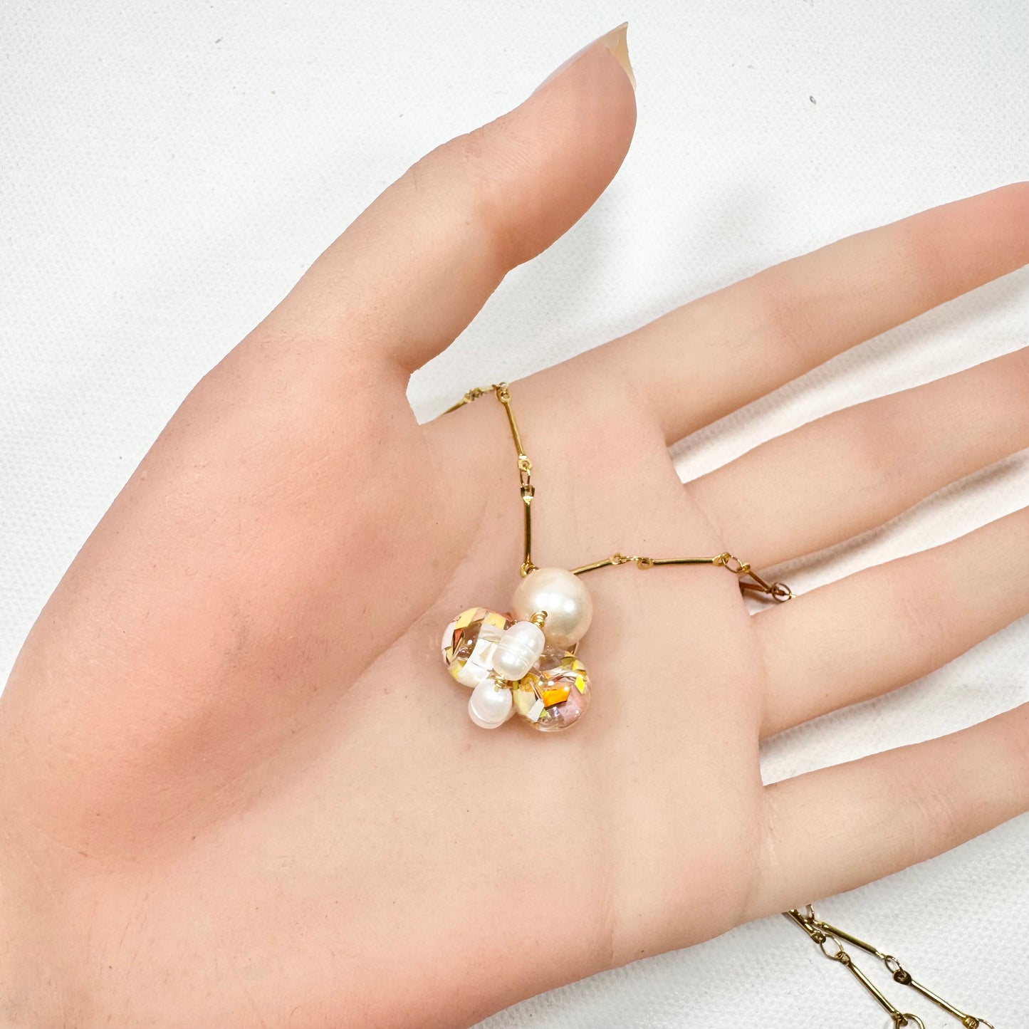 Bee Divine honey bee necklace with fresh water pearls handcrafted from upcycled plastic, featuring delicate bee-inspired designs with lightweight, eco-friendly materials. A sustainable statement piece for nature lovers.