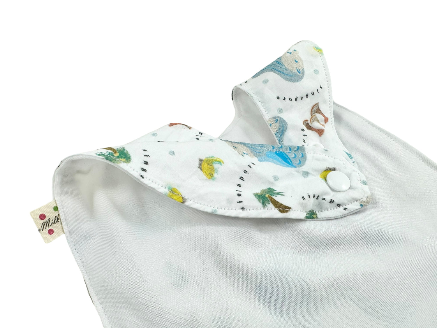Singapore Pop Merlion baby bib by Melmomilk Design – colorful, soft cotton bib featuring a playful Merlion illustration, perfect for gifting or daily use. シンガポール・ポップ・マーライオンよだれかけ / スタイ– カラフルで柔らかいコットン素材、かわいいマーライオンのイラスト入り。ギフトやお土産、普段使いにぴったり。