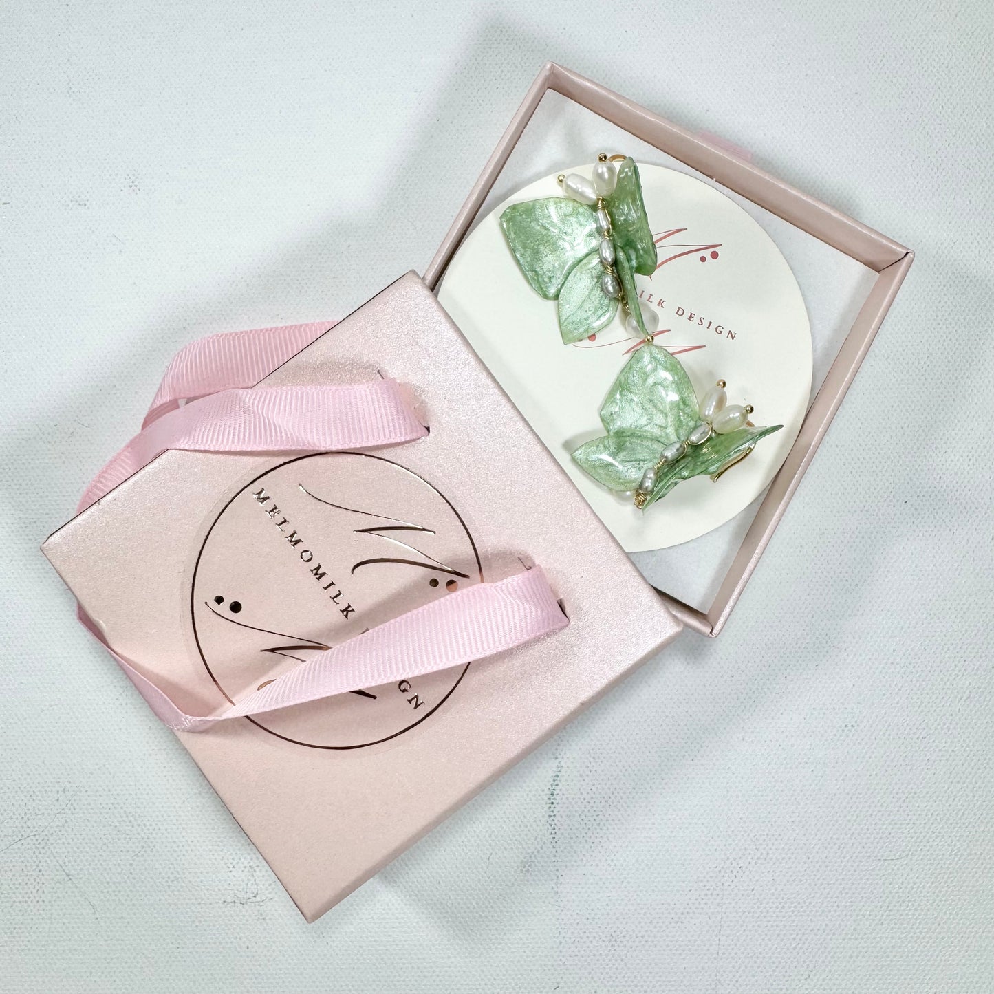 Upcycled butterfly earrings in soft mint green, handcrafted with a nature-inspired design and finished in a fresh Mint Breeze tone.