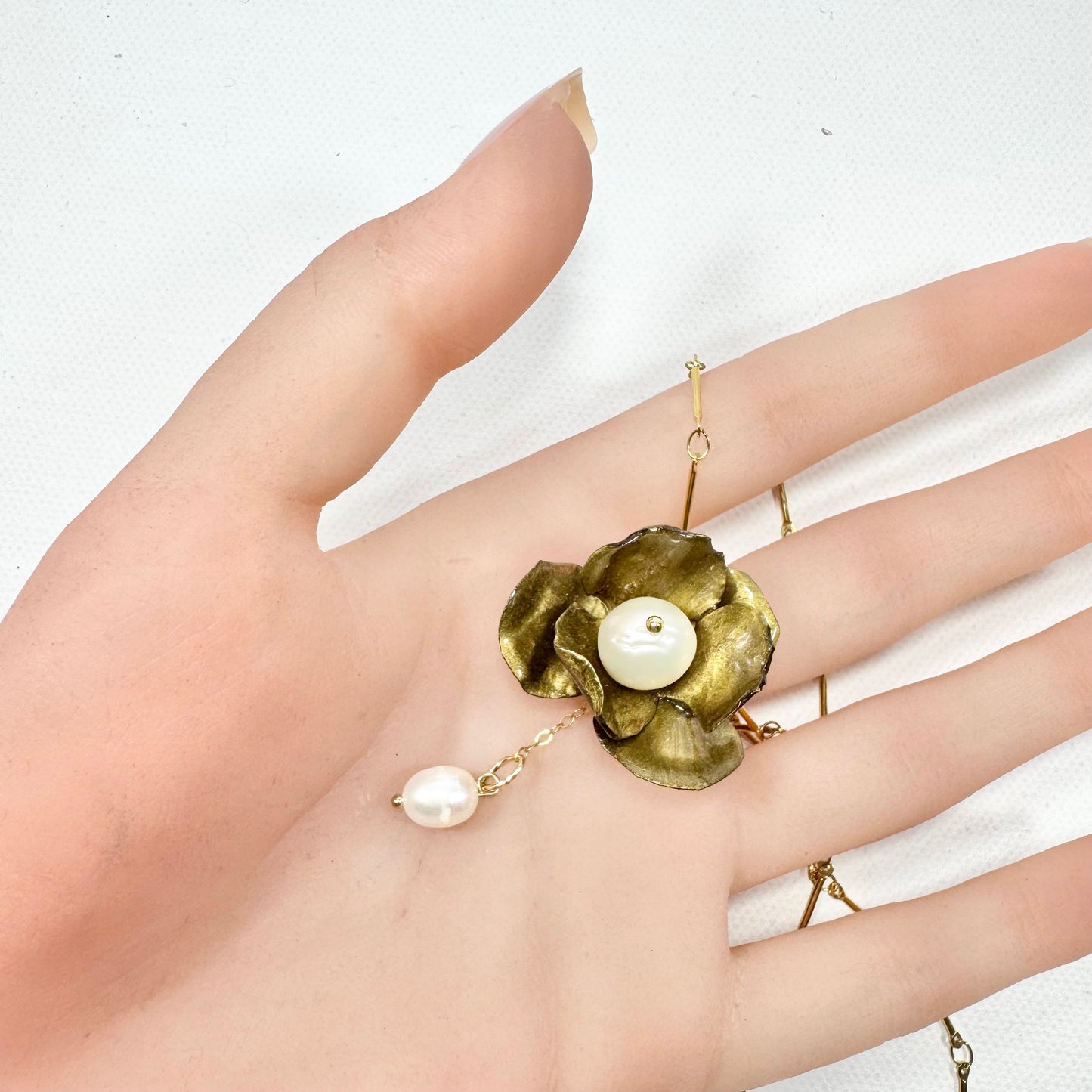 Handcrafted Anemone necklace made from upcycled plastic, inspired by Japanese anemones in vintage gold. Lightweight, eco-friendly statement jewelry for sustainable fashion lovers.