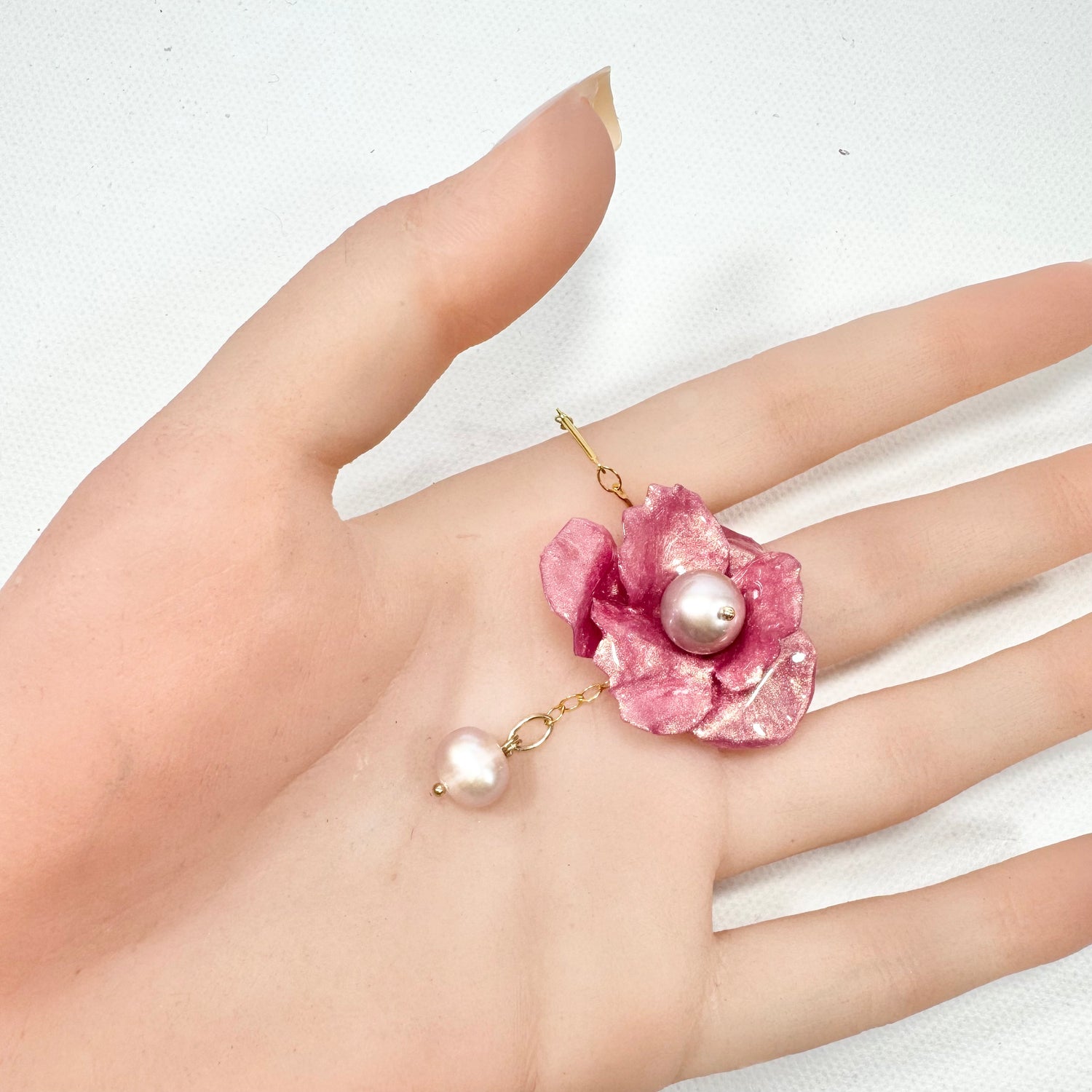 Handcrafted Anemone necklace made from upcycled plastic, inspired by Japanese anemones in Antique petal pink rose. Lightweight, eco-friendly statement jewelry for sustainable fashion lovers.
