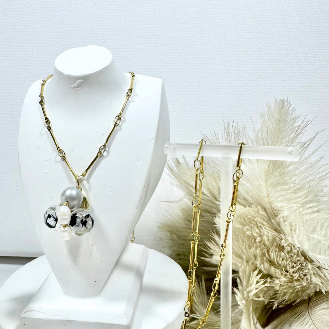 Bee Divine midnight black bee necklace with fresh water pearls handcrafted from upcycled plastic, featuring delicate bee-inspired designs with lightweight, eco-friendly materials. A sustainable statement piece for nature lovers.