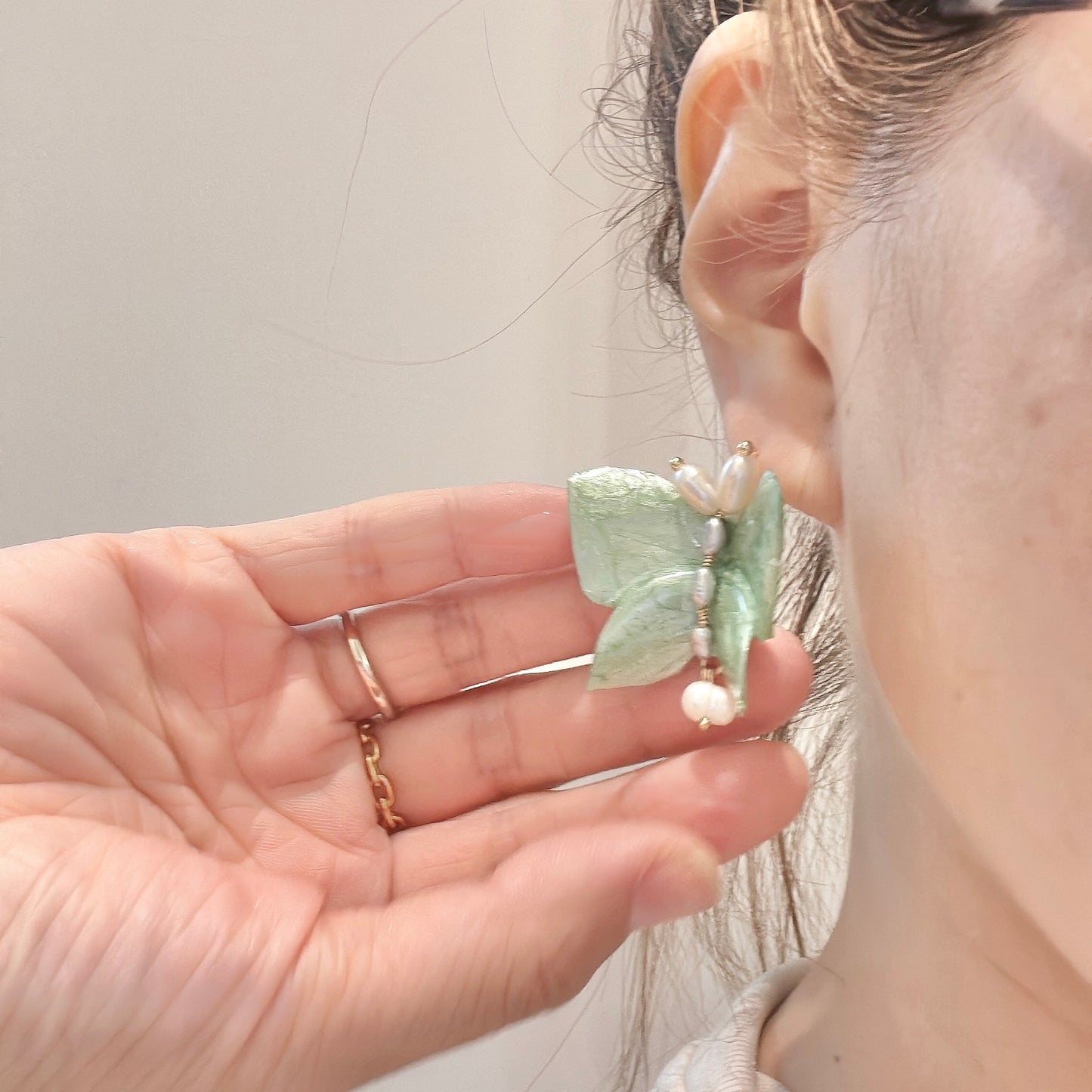Upcycled butterfly earrings in soft mint green, handcrafted with a nature-inspired design and finished in a fresh Mint Breeze tone.