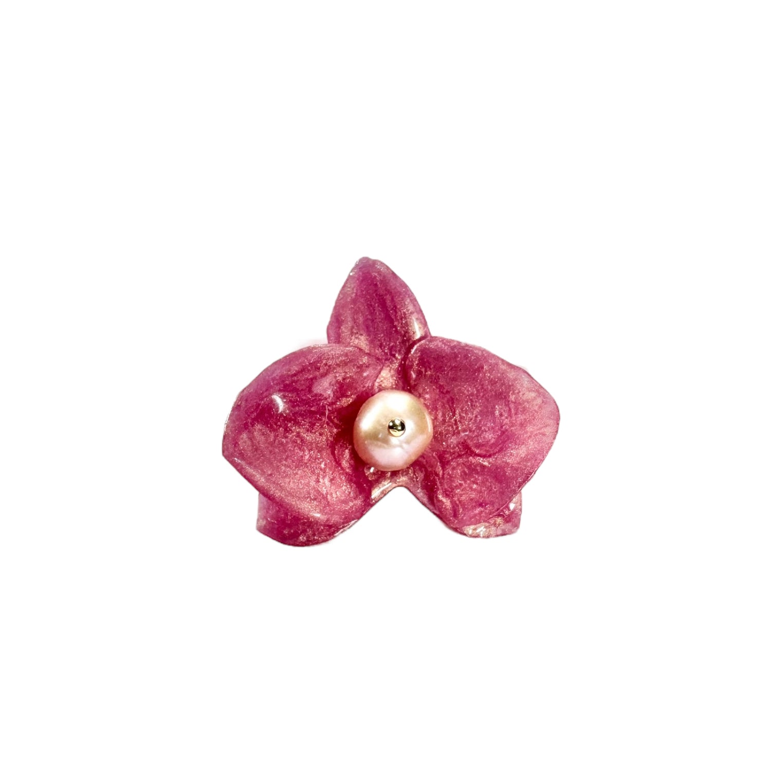 Handcrafted orchid flower ring in soft powder pink, made from upcycled materials with a velvet-like finish.
