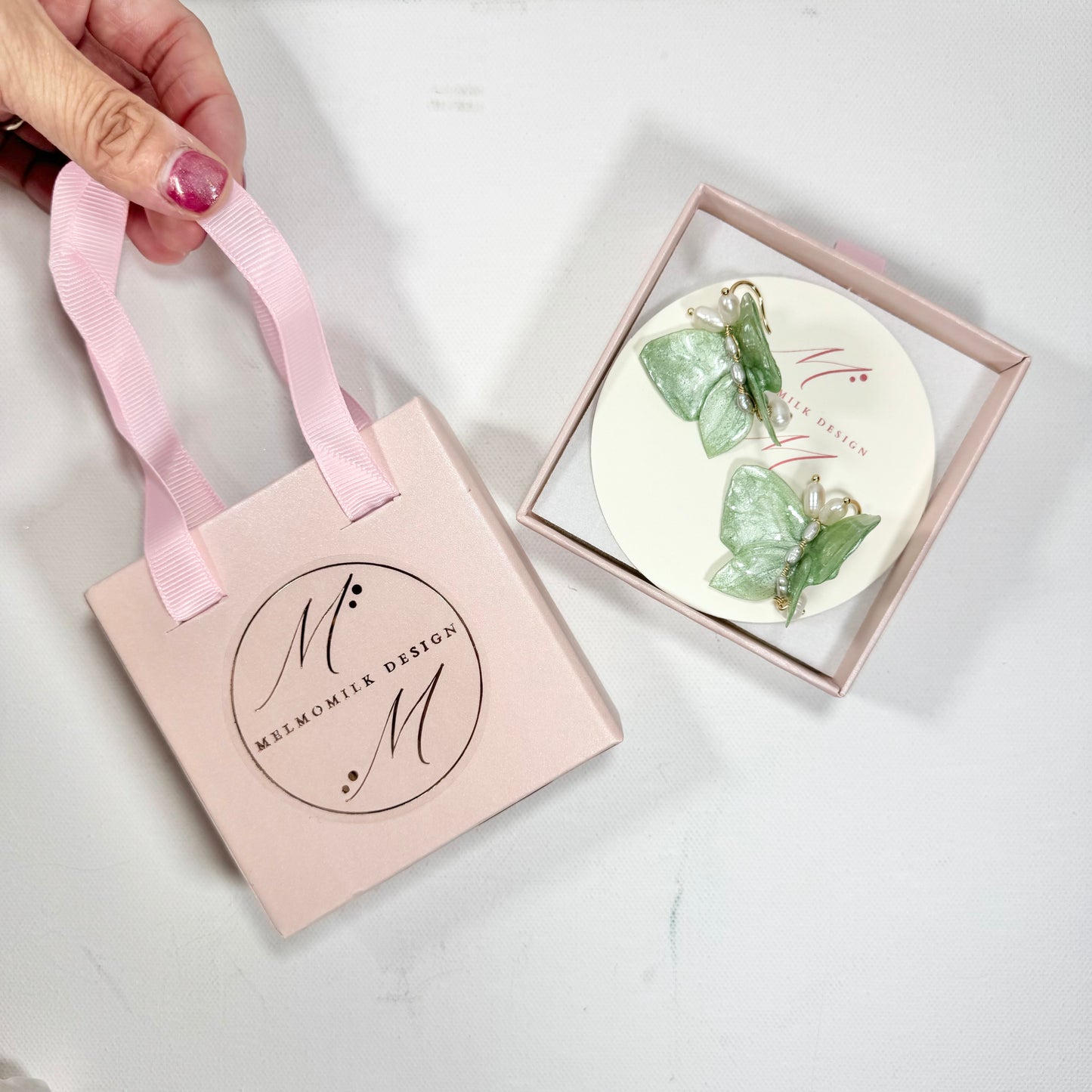 Upcycled butterfly earrings in soft mint green, handcrafted with a nature-inspired design and finished in a fresh Mint Breeze tone.