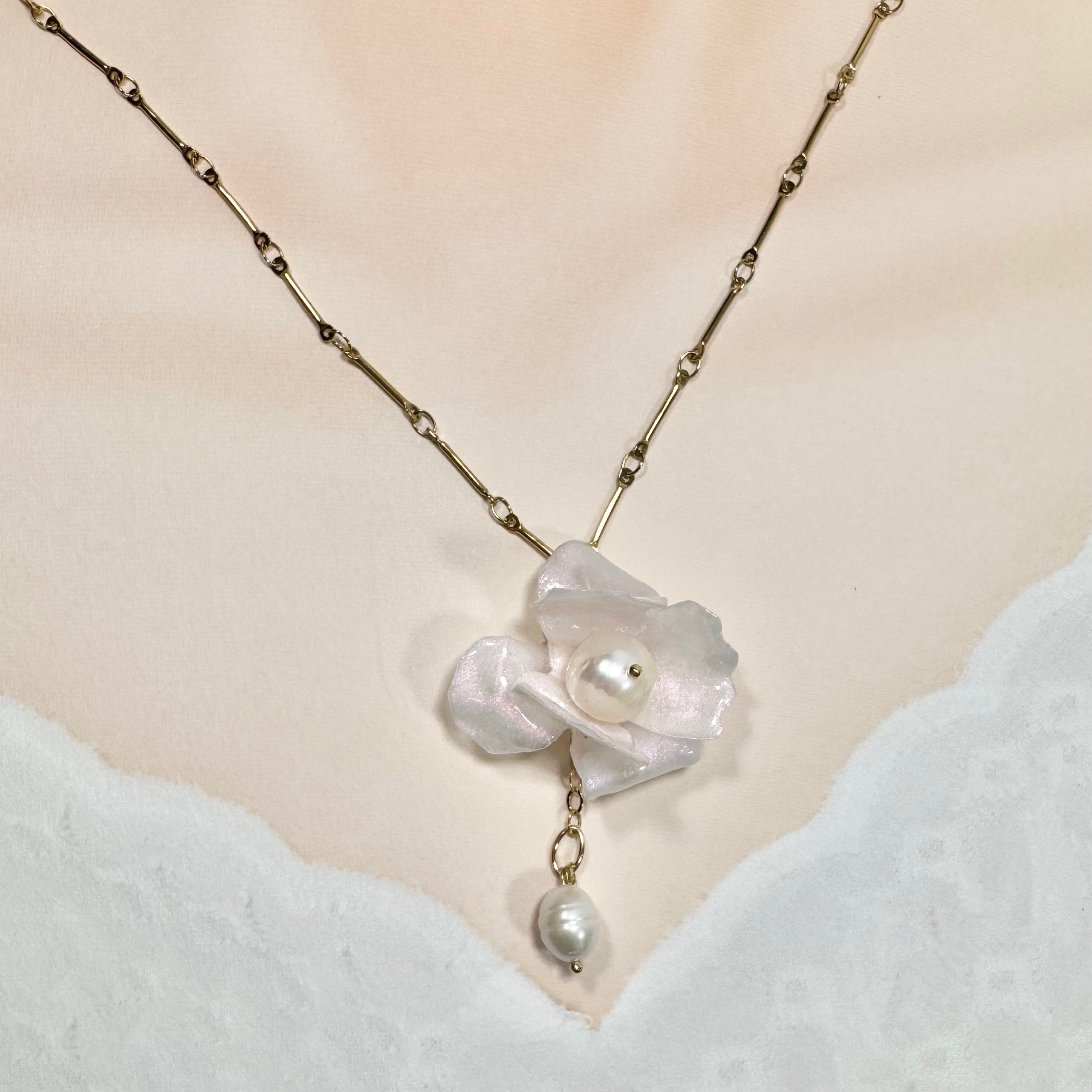 Handcrafted Anemone necklace made from upcycled plastic, inspired by Japanese anemones in white ivory pearl. Lightweight, eco-friendly statement jewelry for sustainable fashion lovers.