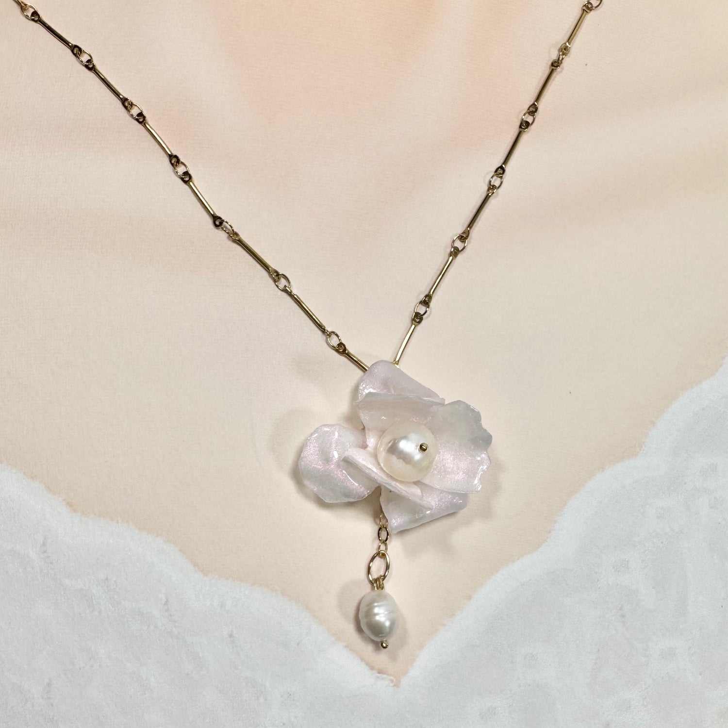 Handcrafted Anemone necklace made from upcycled plastic, inspired by Japanese anemones in white ivory pearl. Lightweight, eco-friendly statement jewelry for sustainable fashion lovers.