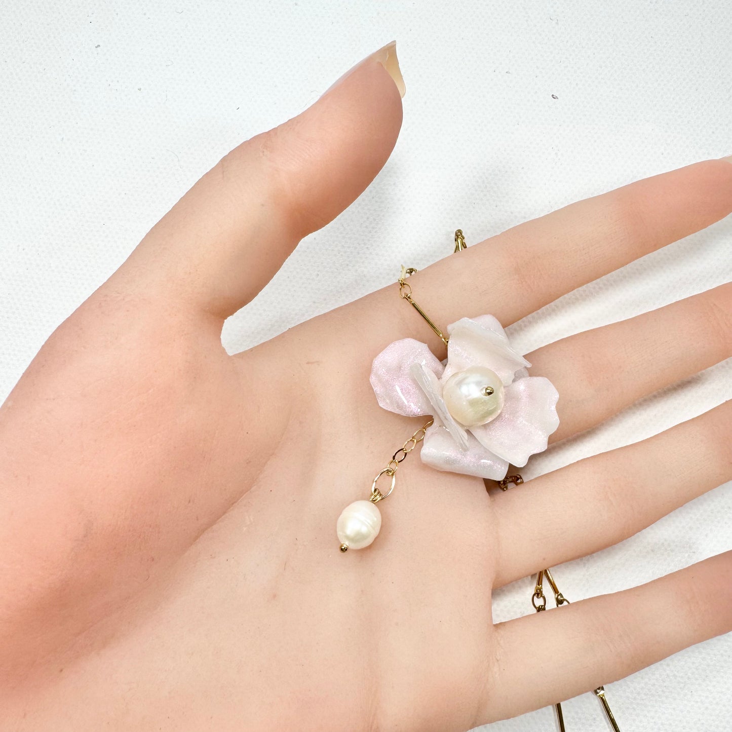 Handcrafted Anemone necklace made from upcycled plastic, inspired by Japanese anemones in white ivory pearl. Lightweight, eco-friendly statement jewelry for sustainable fashion lovers.