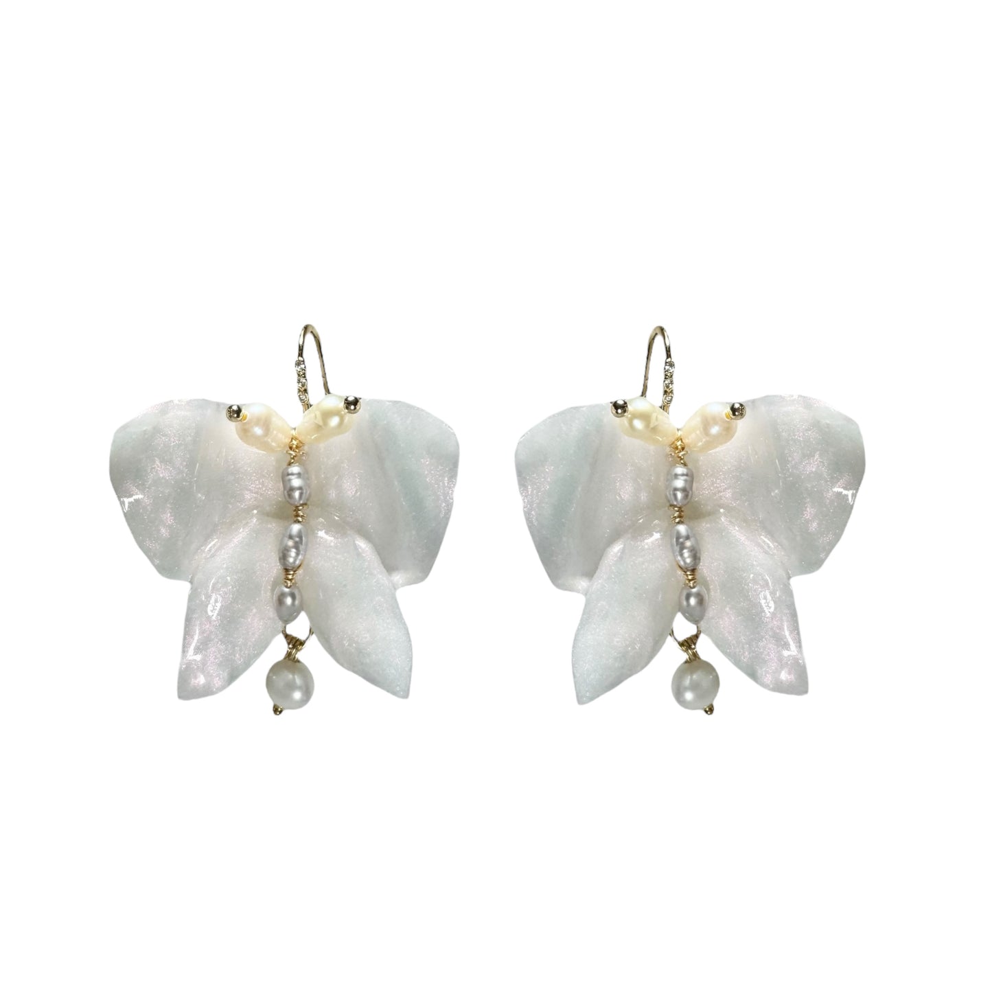 Handcrafted butterfly-shaped earrings in pearl white, made from upcycled materials and finished in a luminous White Silk tone.