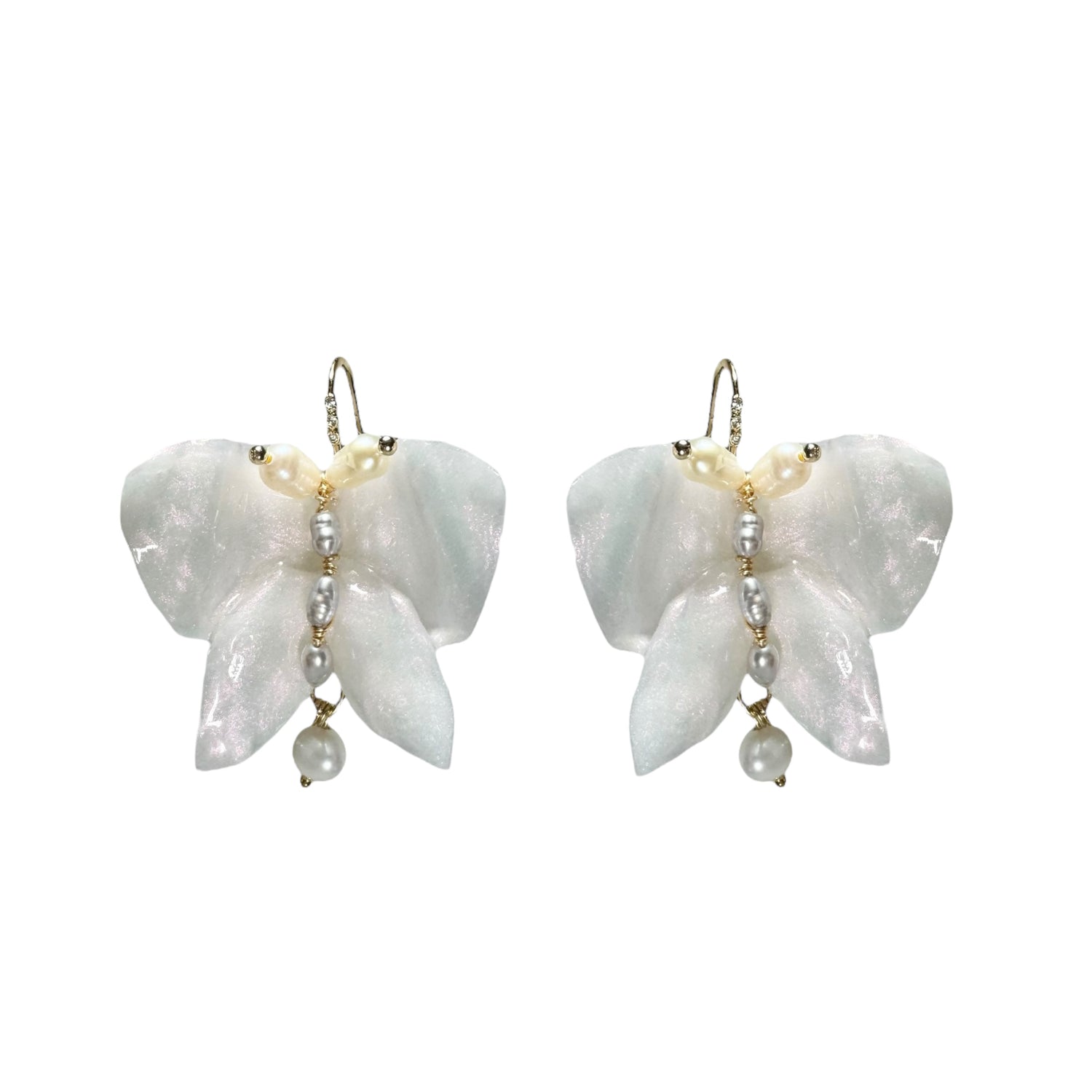 Handcrafted butterfly-shaped earrings in pearl white, made from upcycled materials and finished in a luminous White Silk tone.