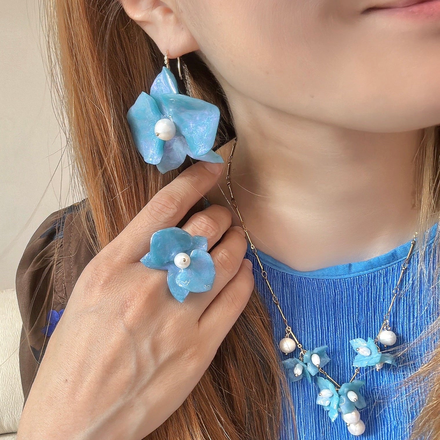 Handmade upcycled orchid earrings crafted from recycled PET bottles, eco-friendly floral jewelry by a Singapore artisan, lightweight and elegant design.