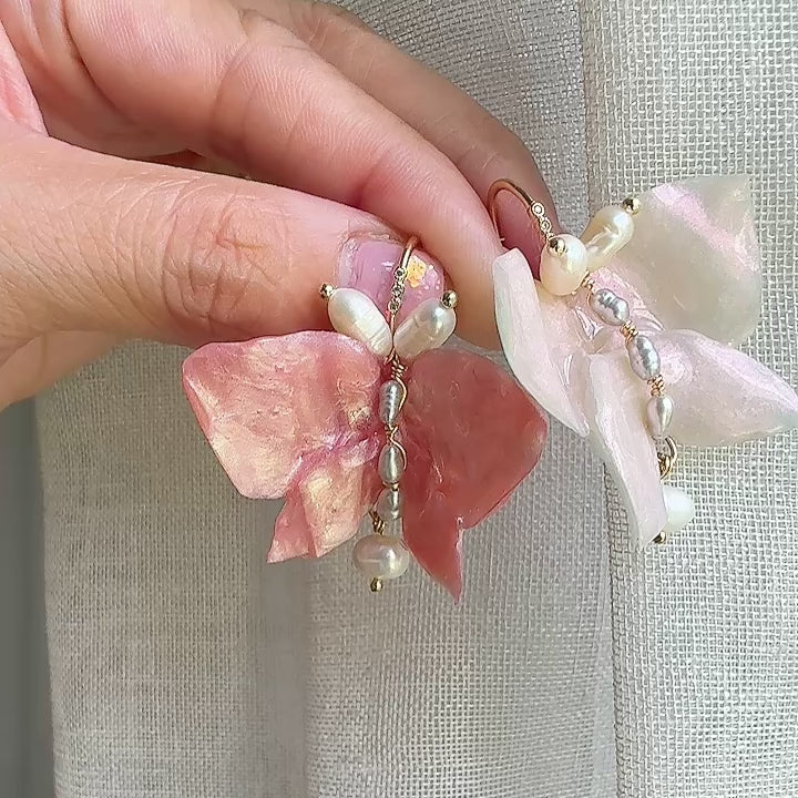 Soft pink butterfly earrings made from upcycled materials, featuring a romantic Pink Chiffon finish and delicate handmade detailing.