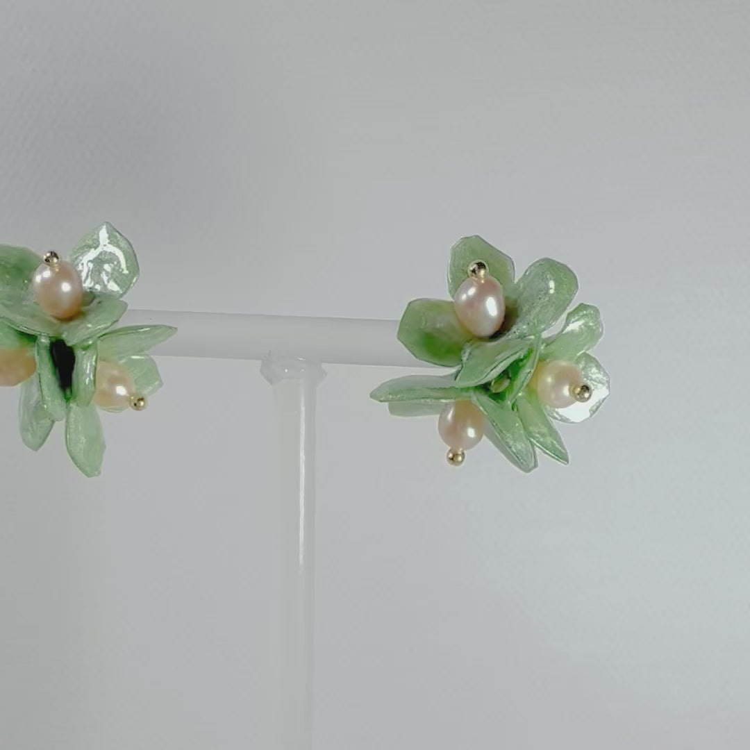 Lilac Fantasy earrings handcrafted from upcycled plastic, featuring pastel lilac, mint green, and black accents. Lightweight, eco-friendly statement jewelry for sustainable fashion lovers.