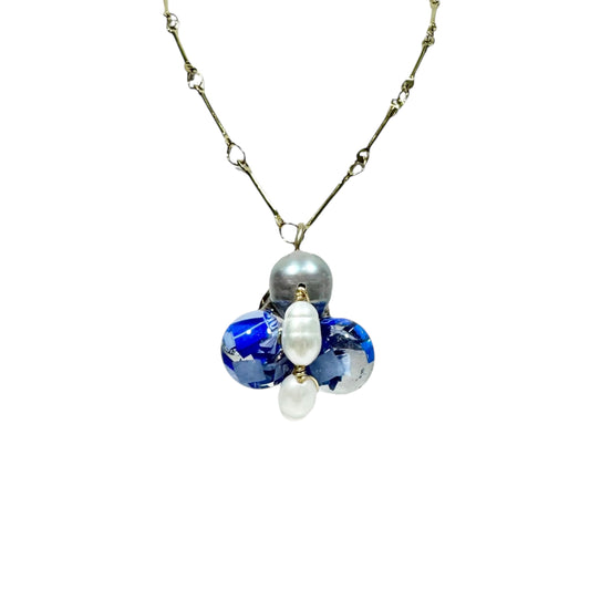 Bee Divine blue bee necklace with fresh water pearls handcrafted from upcycled plastic, featuring delicate bee-inspired designs with lightweight, eco-friendly materials. A sustainable statement piece for nature lovers.