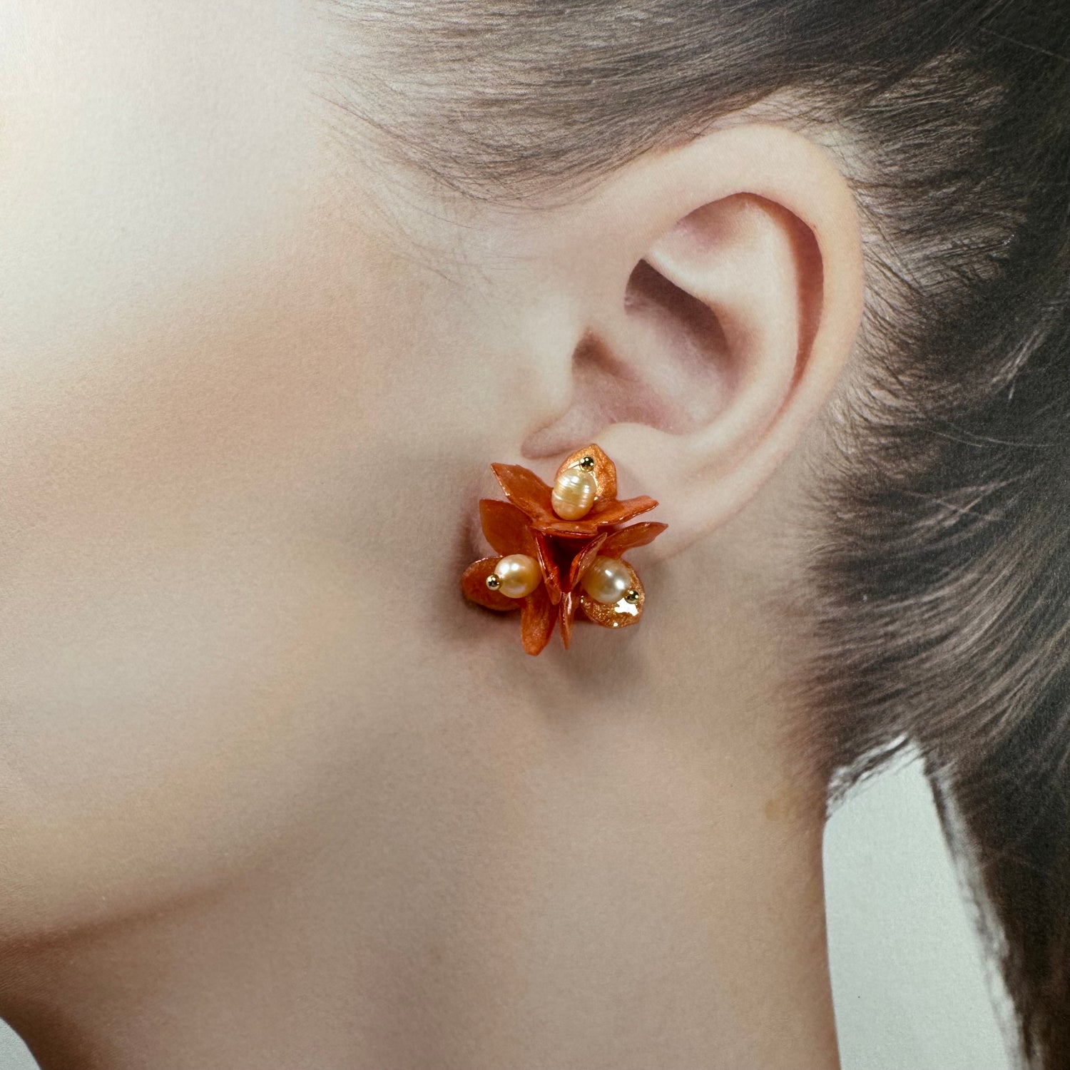 Lilac Fantasy earrings handcrafted from upcycled plastic, featuring amber orange accents. Lightweight, eco-friendly statement jewelry for sustainable fashion lovers.
