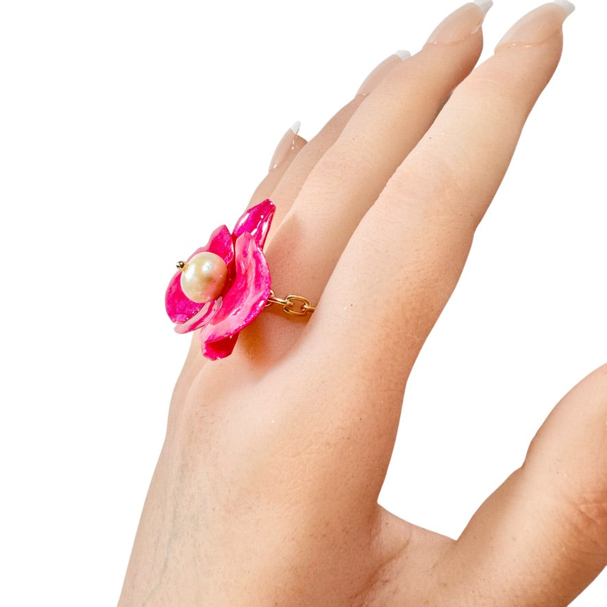 Statement flower ring inspired by orchid petals in rich red, sustainably handcrafted from upcycled materials.

