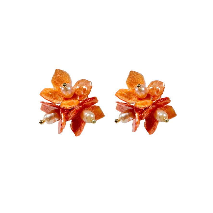 Lilac Fantasy earrings handcrafted from upcycled plastic, featuring amber orange accents. Lightweight, eco-friendly statement jewelry for sustainable fashion lovers.