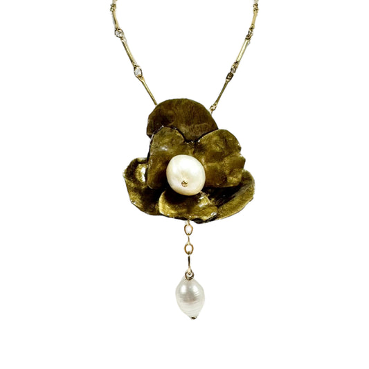 Handcrafted Anemone necklace made from upcycled plastic, inspired by Japanese anemones in vintage gold. Lightweight, eco-friendly statement jewelry for sustainable fashion lovers.