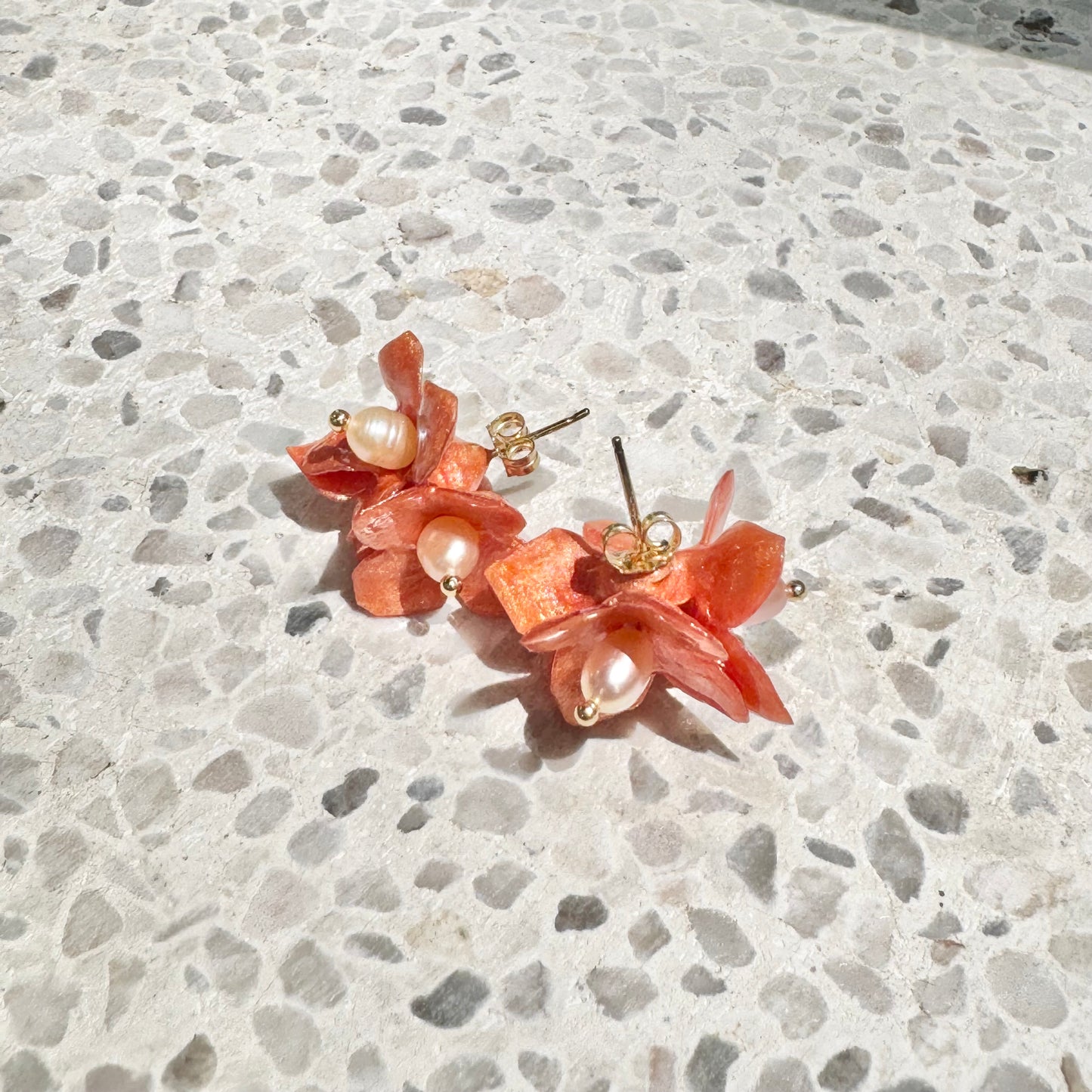 Lilac Fantasy earrings handcrafted from upcycled plastic, featuring amber orange accents. Lightweight, eco-friendly statement jewelry for sustainable fashion lovers.