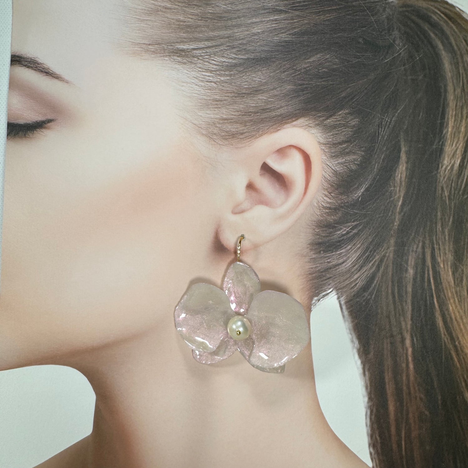 Handmade upcycled orchid earrings crafted from recycled PET bottles, eco-friendly floral jewelry by a Singapore artisan, lightweight and elegant design.