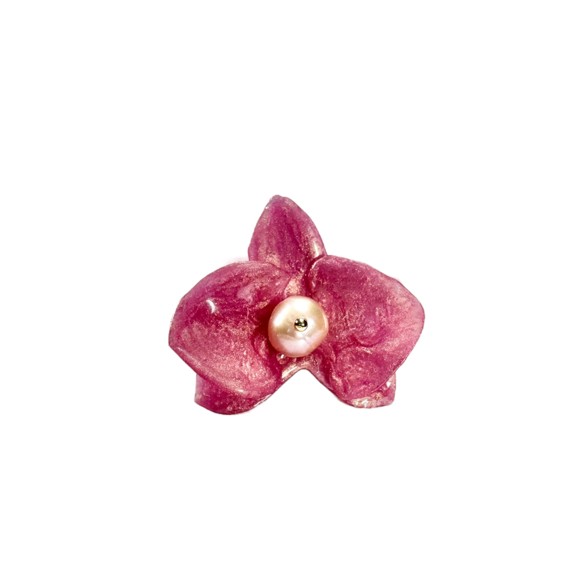 Handcrafted orchid flower ring in soft powder pink, made from upcycled materials with a velvet-like finish.
