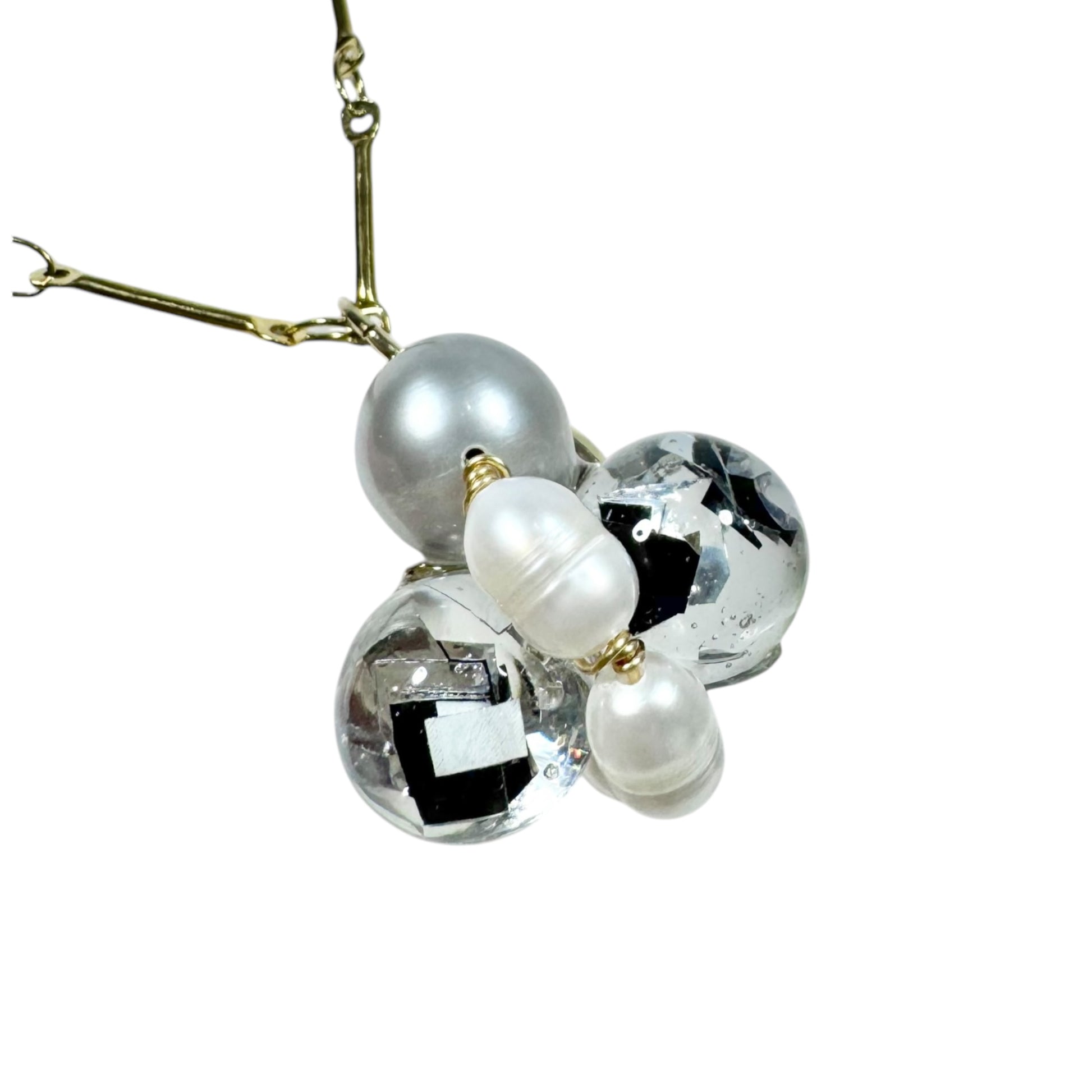 Bee Divine midnight black bee necklace with fresh water pearls handcrafted from upcycled plastic, featuring delicate bee-inspired designs with lightweight, eco-friendly materials. A sustainable statement piece for nature lovers.