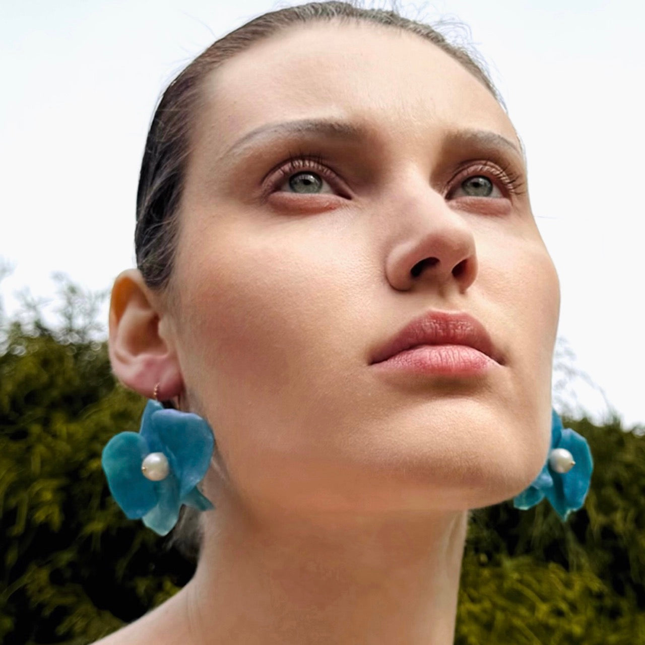 Handmade upcycled orchid earrings crafted from recycled PET bottles, eco-friendly floral jewelry by a Singapore artisan, lightweight and elegant design.