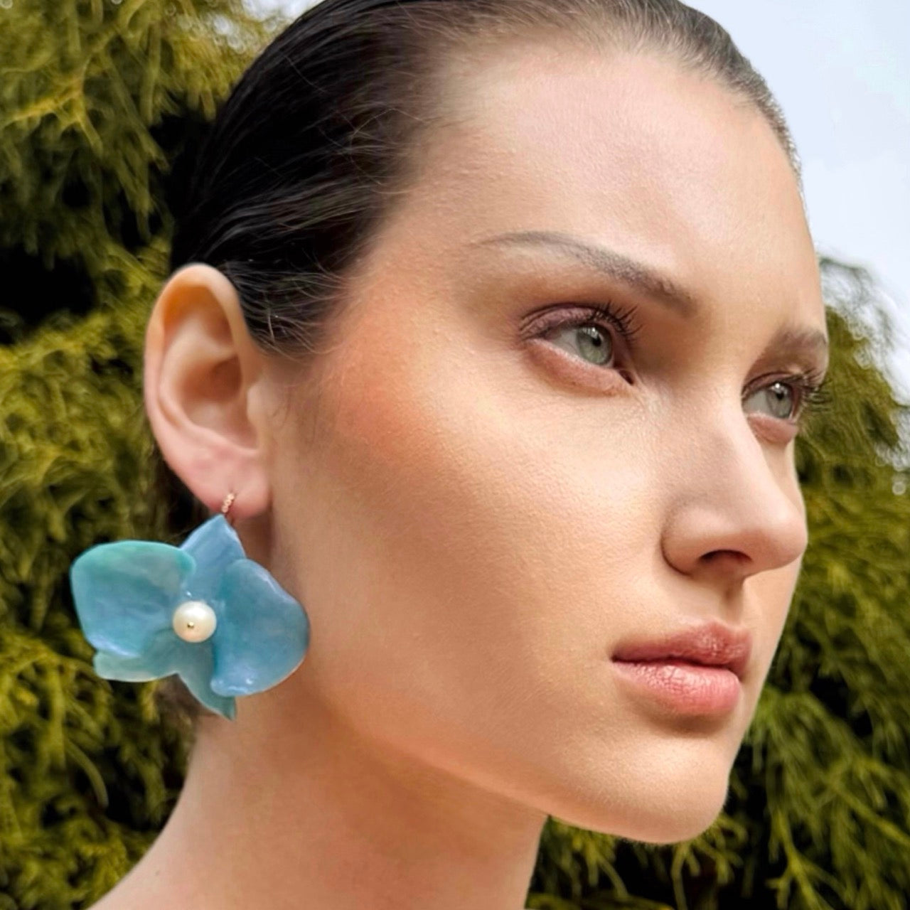 Handmade upcycled orchid earrings crafted from recycled PET bottles, eco-friendly floral jewelry by a Singapore artisan, lightweight and elegant design.