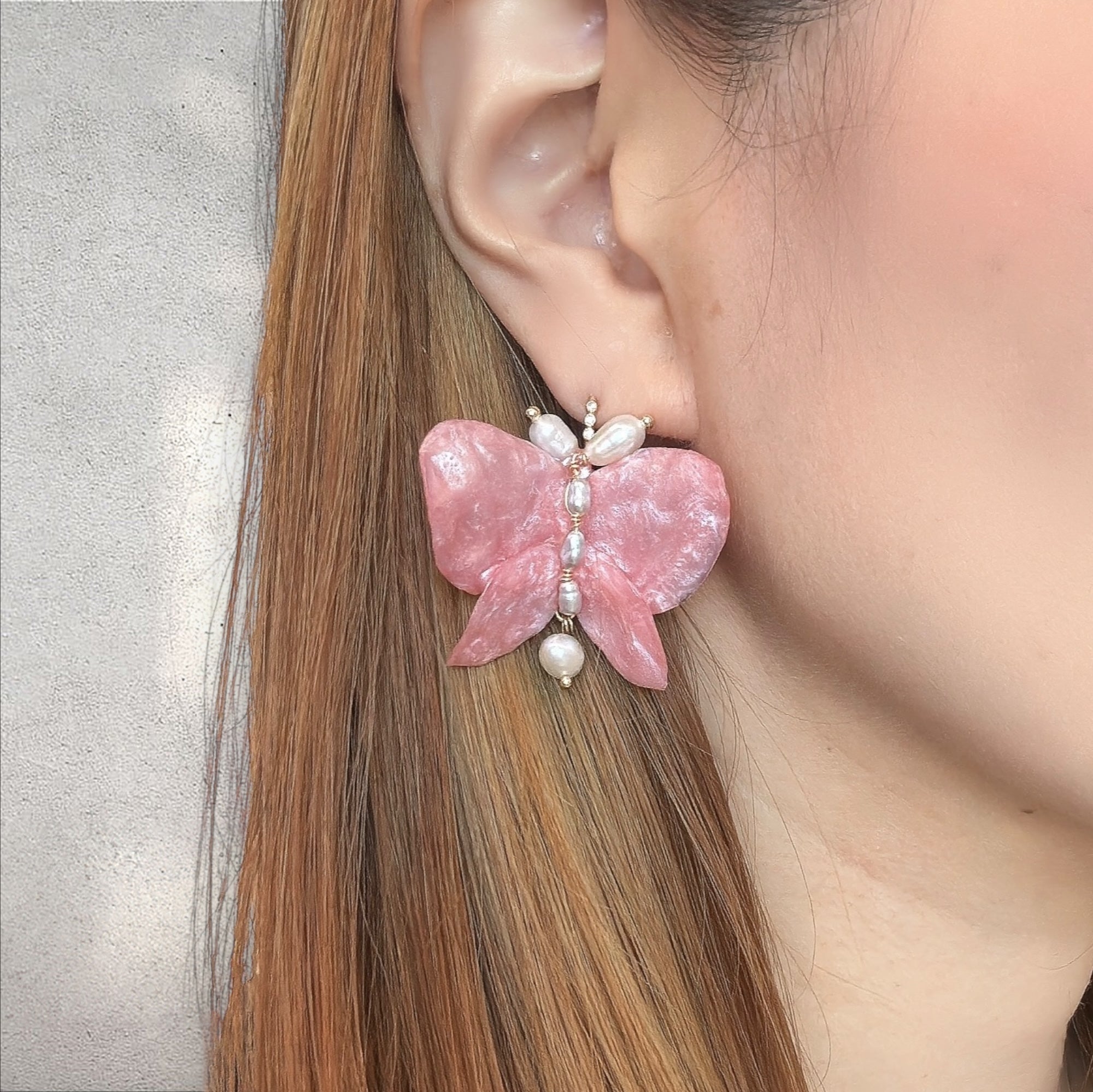 Side view of Pink Chiffon butterfly earrings, lightweight upcycled plastic hook earrings handcrafted in Singapore