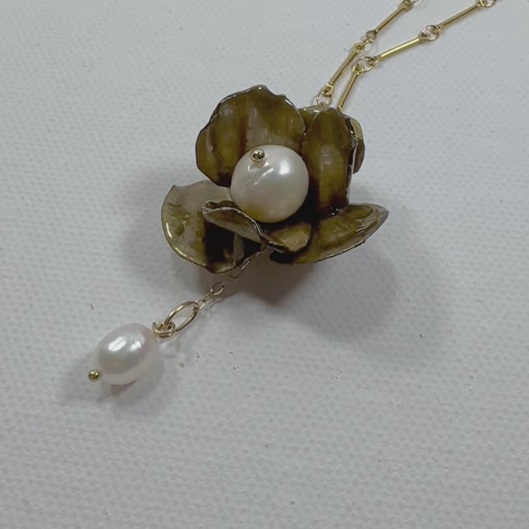 Handcrafted Anemone necklace made from upcycled plastic, inspired by Japanese anemones in vintage gold. Lightweight, eco-friendly statement jewelry for sustainable fashion lovers.