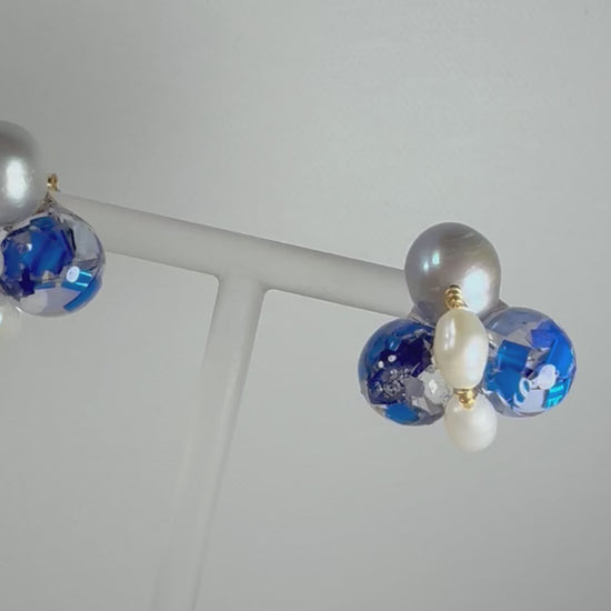 Bee Divine blue bee earrings with fresh water pearls handcrafted from upcycled plastic, featuring delicate bee-inspired designs with lightweight, eco-friendly materials. A sustainable statement piece for nature lovers.