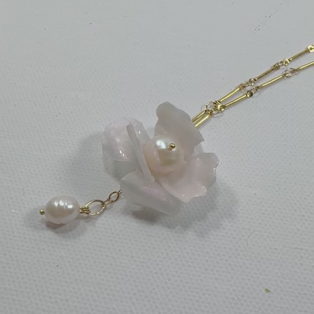 Handcrafted Anemone necklace made from upcycled plastic, inspired by Japanese anemones in white ivory pearl. Lightweight, eco-friendly statement jewelry for sustainable fashion lovers.